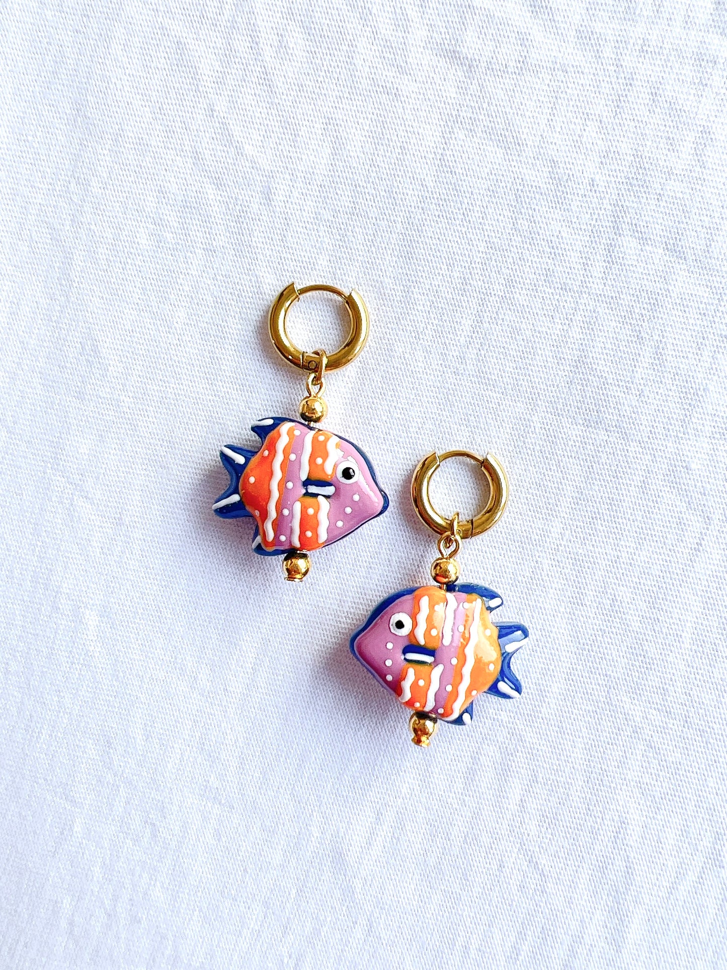 “Something Fishy” - Fish Earrings in Pink and Blue in a Gold Huggie Hoop