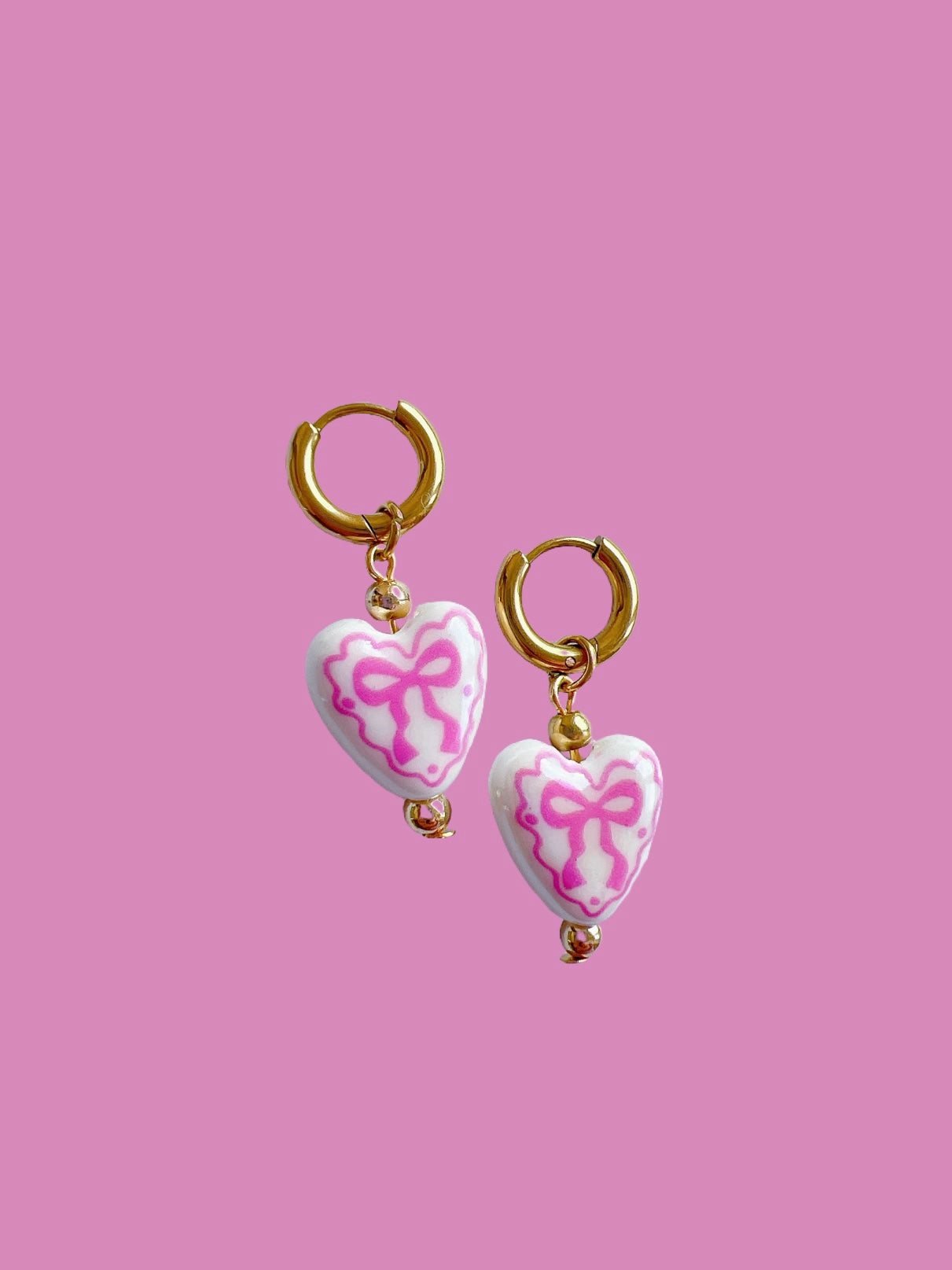 “Chloë” - Porcelain Bow Hearts on Gold Huggie Hoops