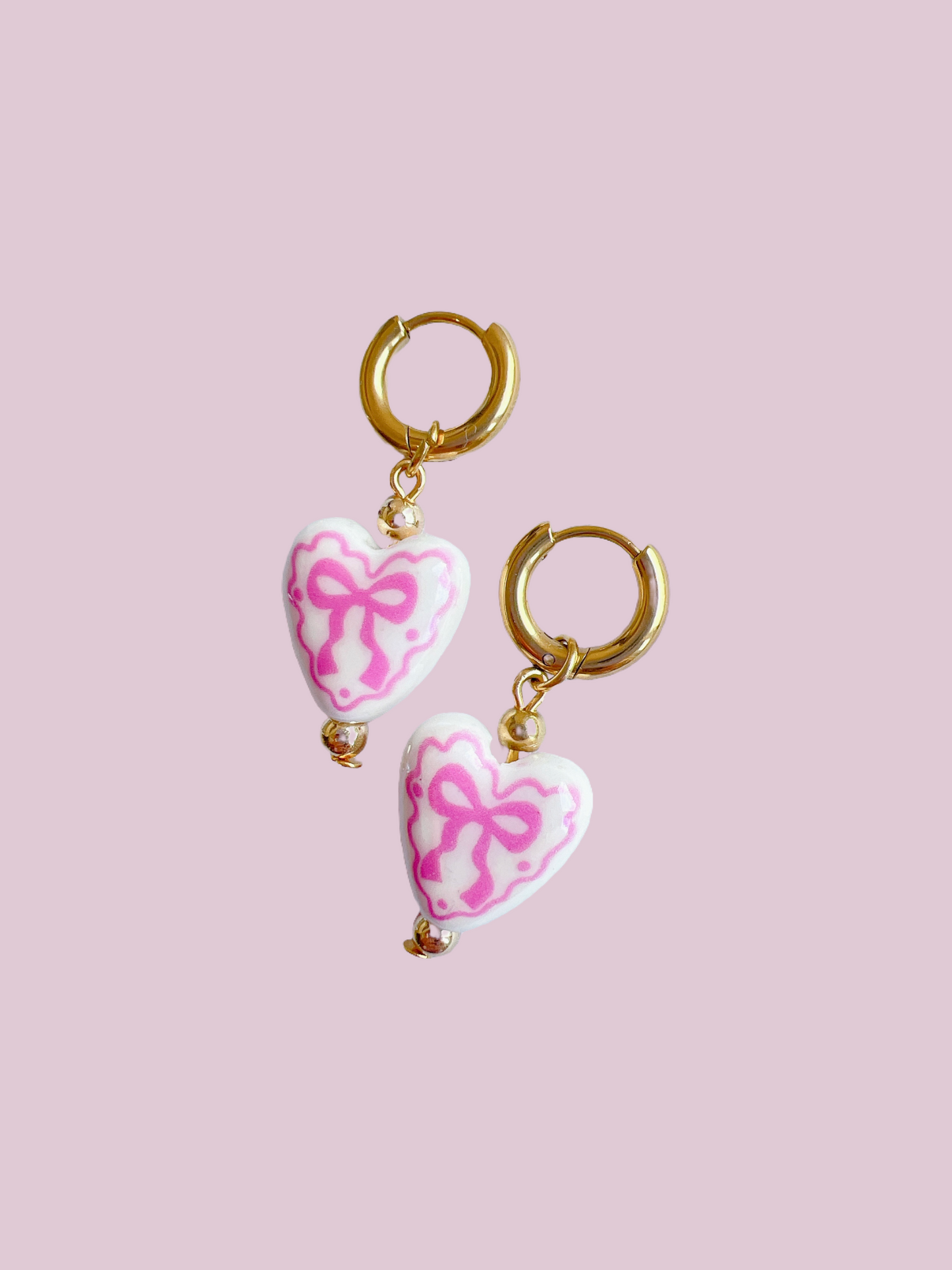 “Chloë” - Porcelain Bow Hearts on Gold Huggie Hoops