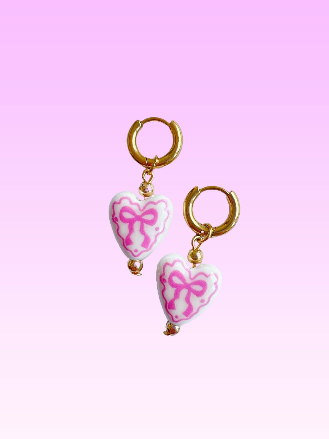 “Chloë” - Porcelain Bow Hearts on Gold Huggie Hoops